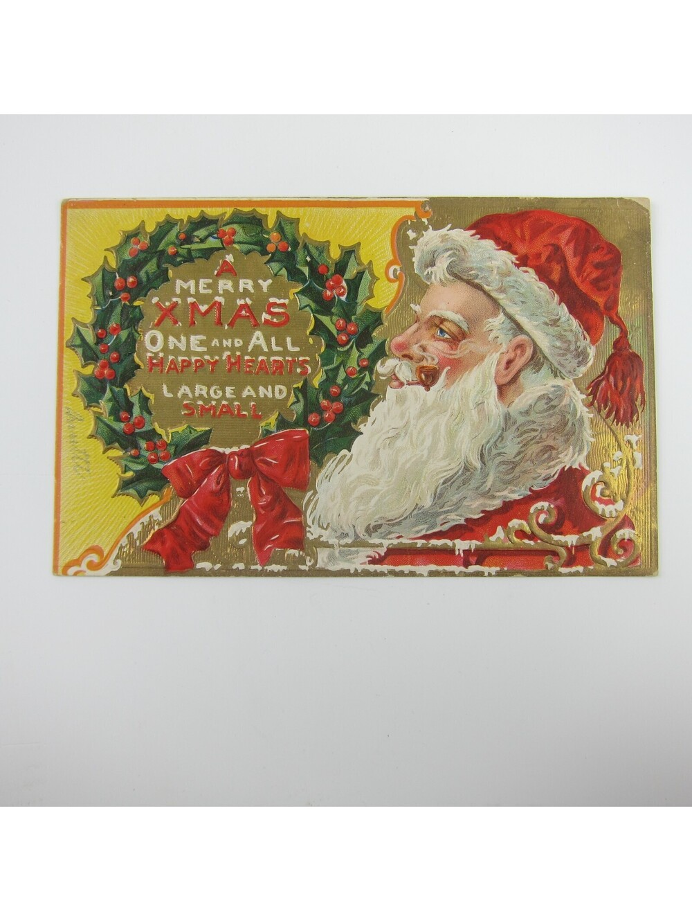 Vintage Christmas Postcard Santa Pipe Holly Berries Wreath Gold Embossed Antique